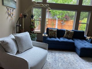 Nolan II Grey Swivel Cuddler | Fabric
